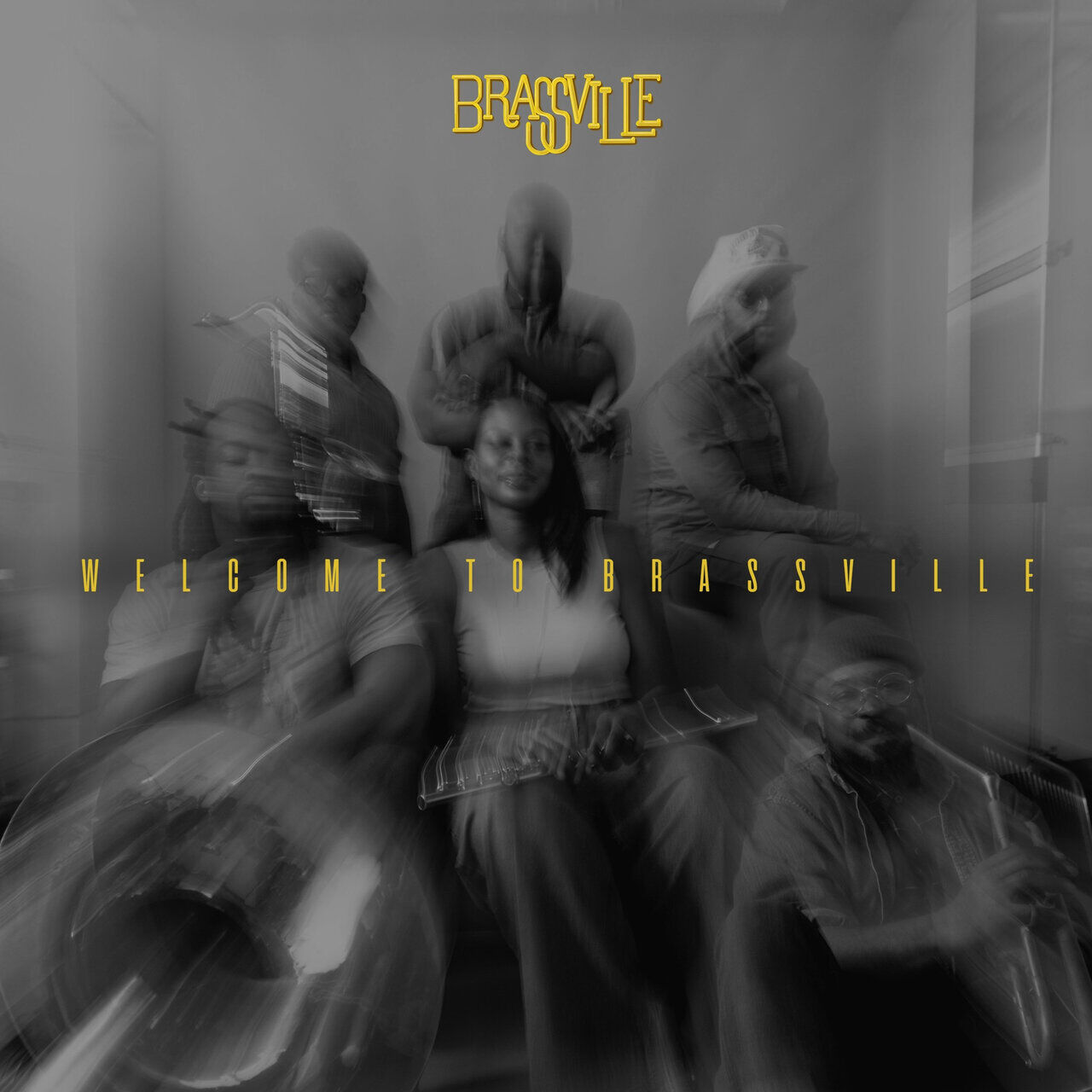 Album art Welcome to Brassville band sits together in black and white photo enhanced with motion blur